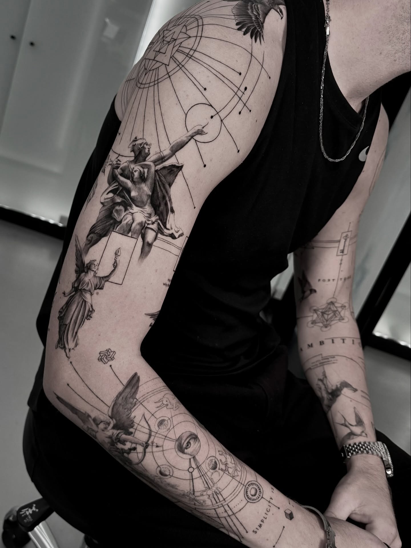 Angled view where the shoulder anchor and the falling figures read along the arm